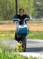 Amish girl on a scooter